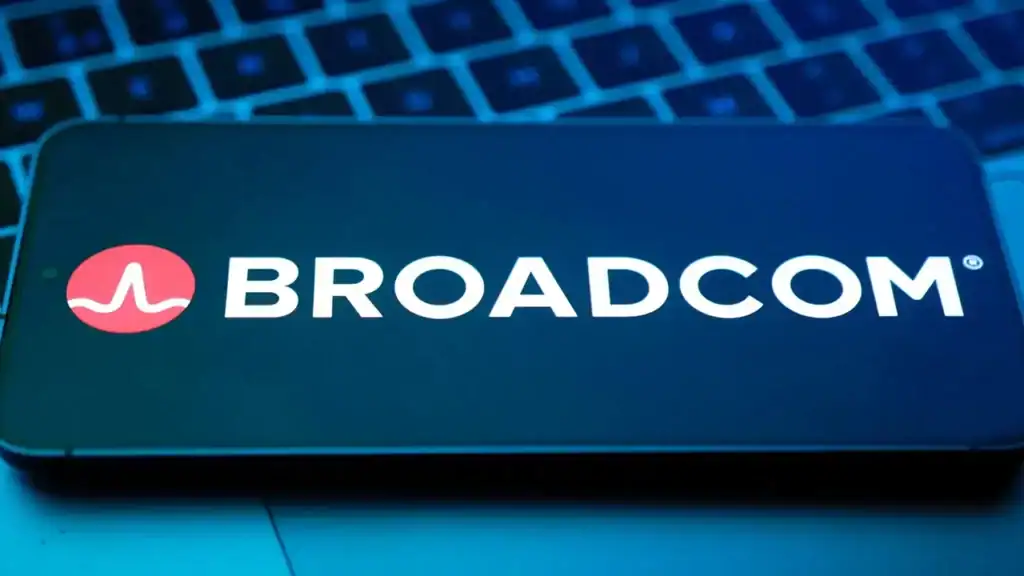 Broadcom logo displayed on smartphone screen with laptop keyboard background